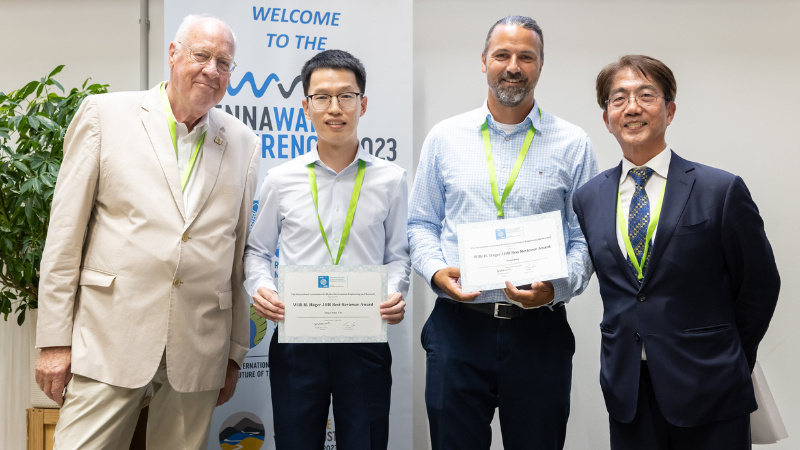 Dr Daniel B. Bung and Dr Tong-Chuan Che receive the 8th Willi H. Hager JHR Best Reviewer Award from Prof. Willi Hager and IAHR President Prof. Joseph Hun-Wei Lee.